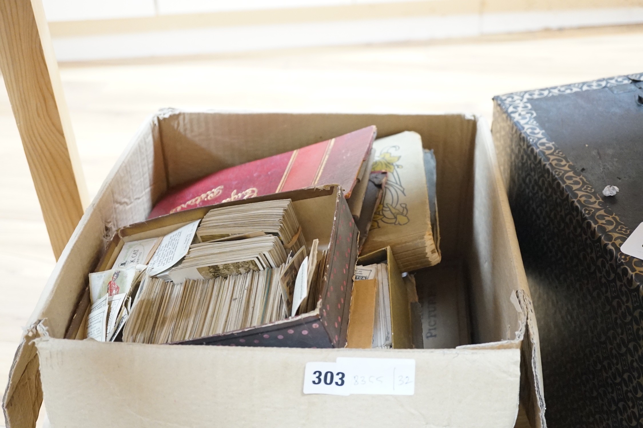A large collection of mounted and loose cigarette cards